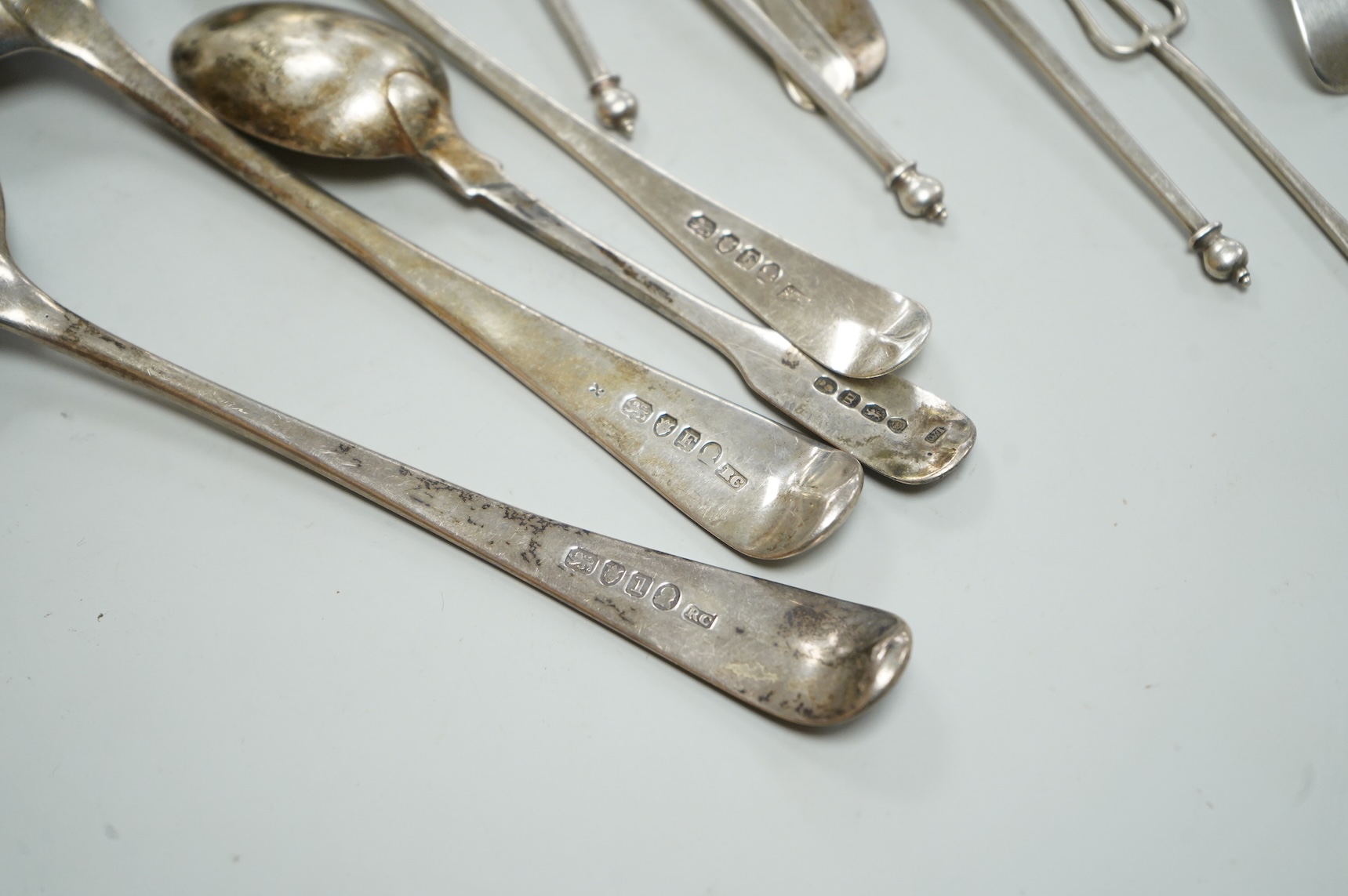 A collection of assorted 19th century and later silver flatware, including two George III table spoons, London, 1808 and 1804, various pattern, dates and makers, 13.1oz.